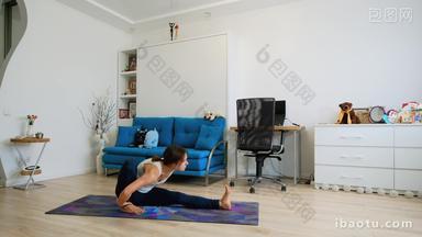 Young woman doing yoga pose dedicated to the sage marichi I at home